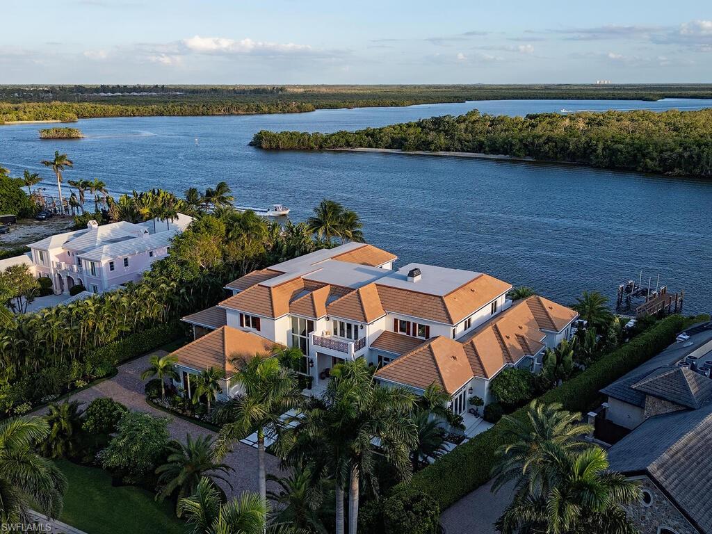 860 Admiralty Parade Naples, FL 34102 - Photo 45 of 45 an aerial view of a house with a lake view
