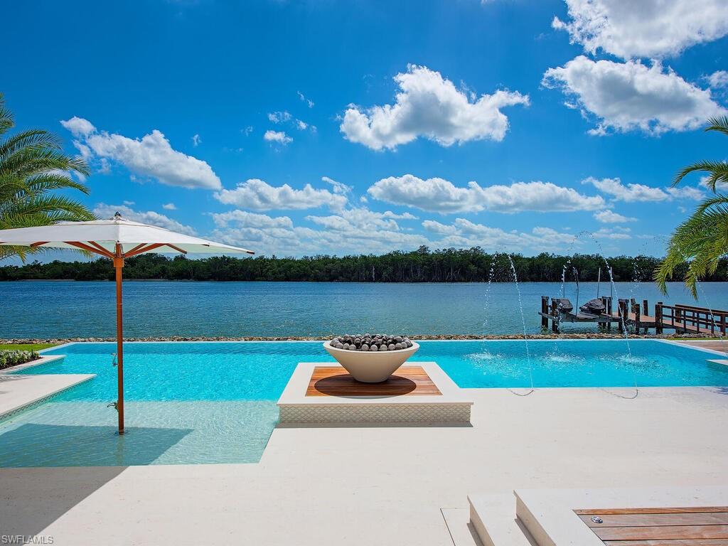 860 Admiralty Parade Naples, FL 34102 - Photo 5 of 45 a view of a garden with a slide