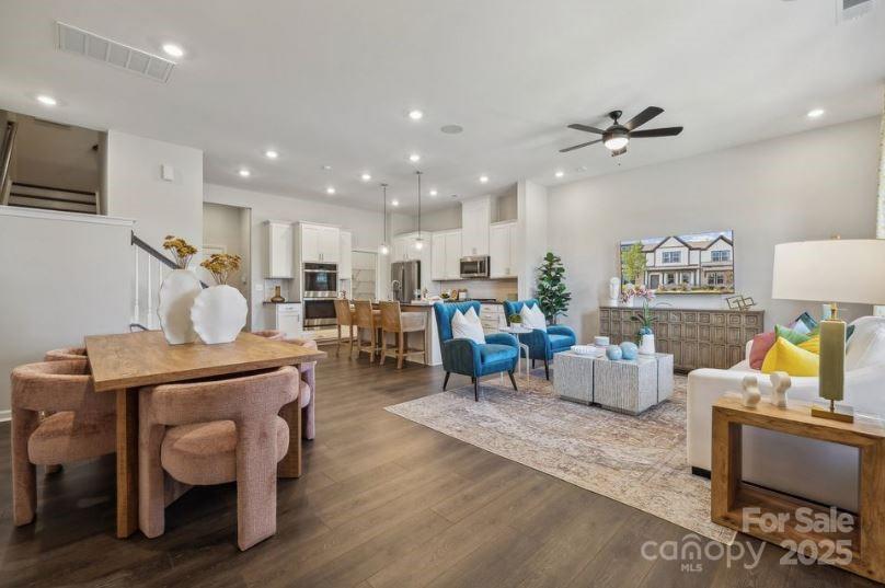 8664 Miles Gap Road Indian Land, SC 29707 - Photo 11 of 29 a living room with furniture kitchen view and a wooden floor