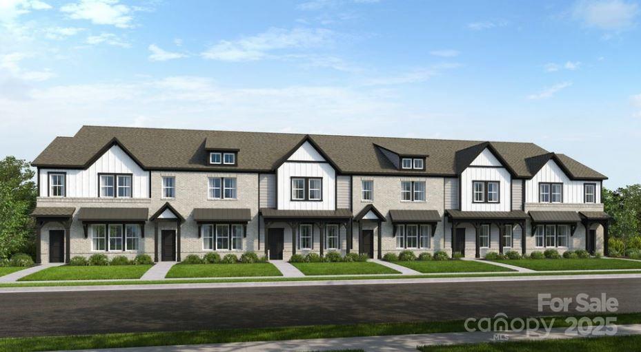 8664 Miles Gap Road Indian Land, SC 29707 - Photo 2 of 29 a front view of a residential apartment building with a yard