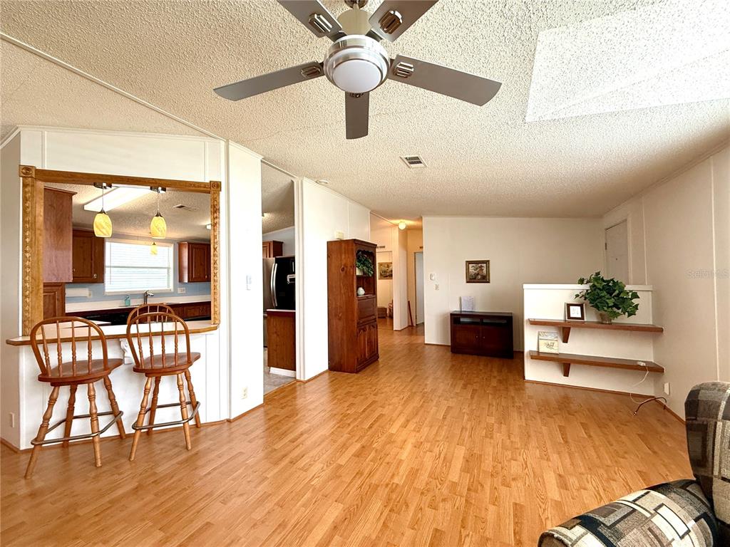 222 North St George Circle Apollo Beach, FL 33572 - Photo 15 of 33 a living room with furniture and a wooden floor