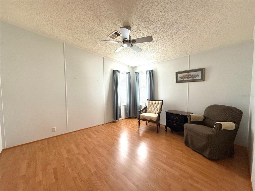 222 North St George Circle Apollo Beach, FL 33572 - Photo 18 of 33 a view of livingroom with furniture and wooden floor