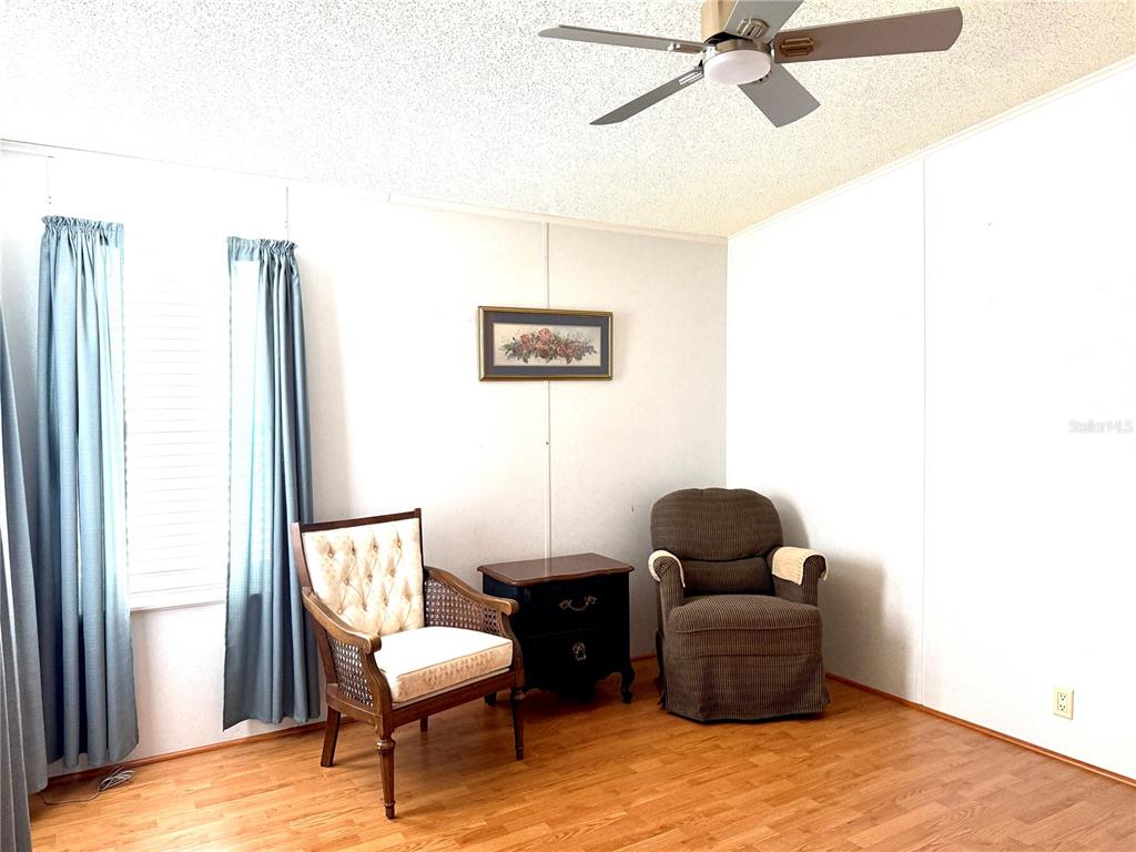 222 North St George Circle Apollo Beach, FL 33572 - Photo 19 of 33 a living room with furniture and a window