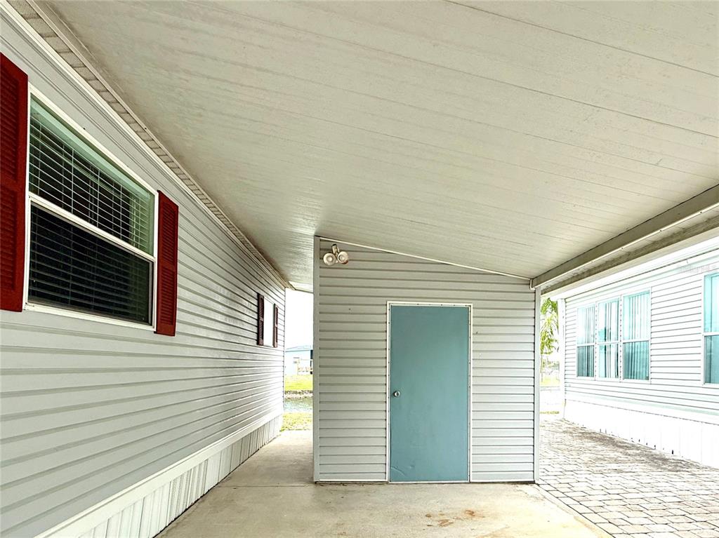222 North St George Circle Apollo Beach, FL 33572 - Photo 22 of 33 a view of a house with a door and wooden floor