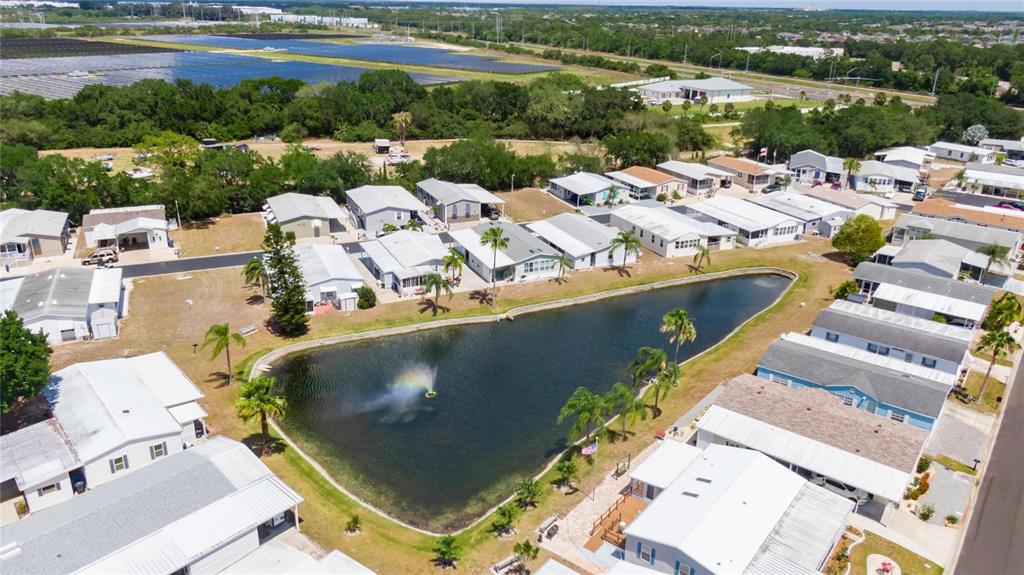 222 North St George Circle Apollo Beach, FL 33572 - Photo 33 of 33 an aerial view of a house with a lake view