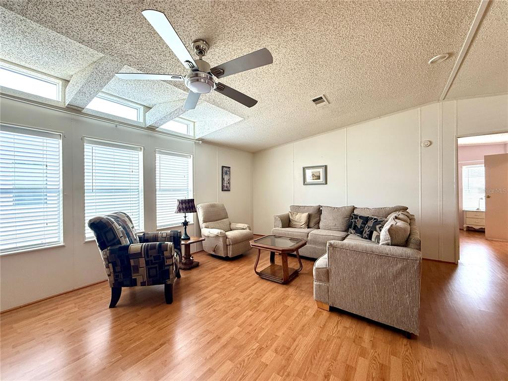222 North St George Circle Apollo Beach, FL 33572 - Photo 4 of 33 a living room with furniture and a large window