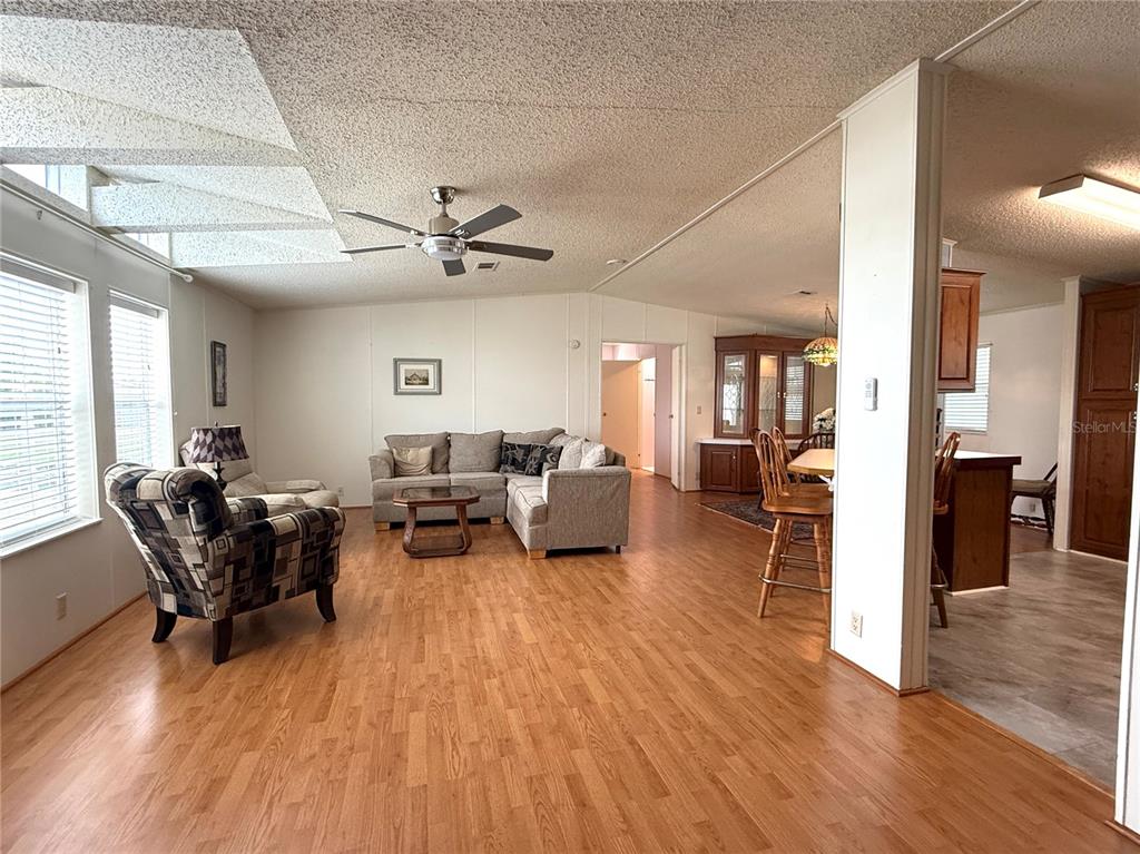 222 North St George Circle Apollo Beach, FL 33572 - Photo 5 of 33 a living room with furniture and a wooden floor