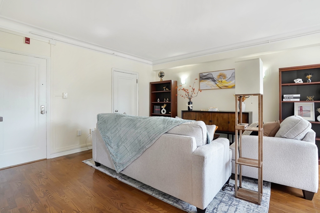 20 Chapel Street, Unit B801 Brookline, MA 02446 - Photo 3 of 16 a living room with furniture and a couch