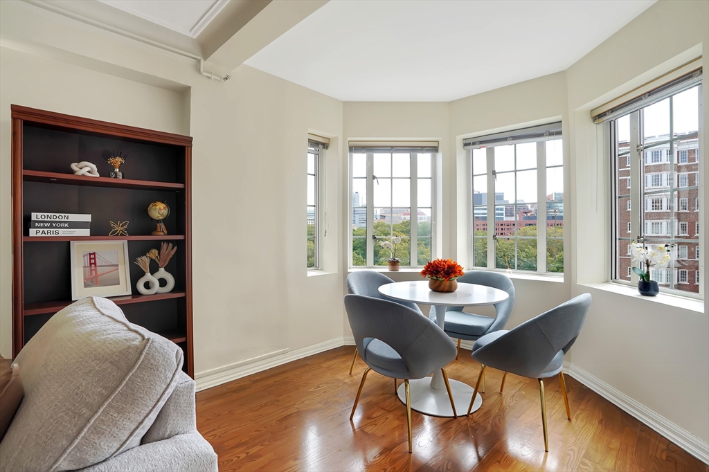 20 Chapel Street, Unit B801 Brookline, MA 02446 - Photo 5 of 16 a dining room with furniture and wooden floor