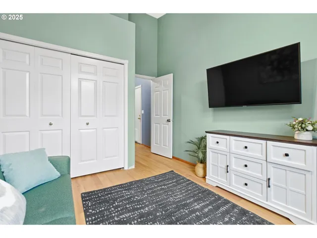 a bed room with a bed window and table