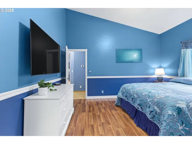 a bedroom with a bed and a dresser