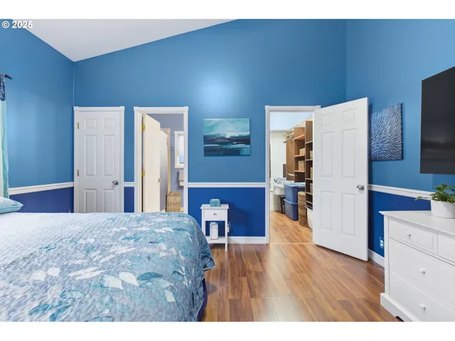 a bathroom with a sink a toilet a mirror and vanity