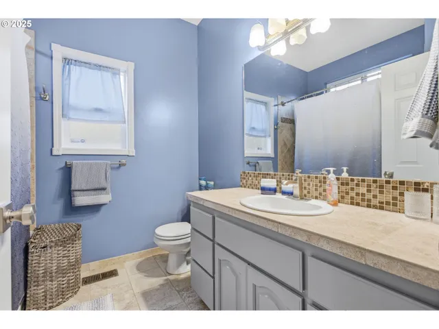 a bathroom with a tub and shower