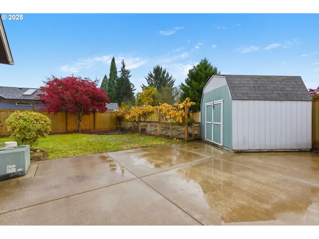 a view of a house with a backyard
