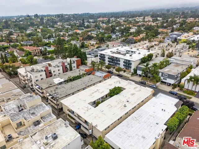 an aerial view of a house with a swimming pool