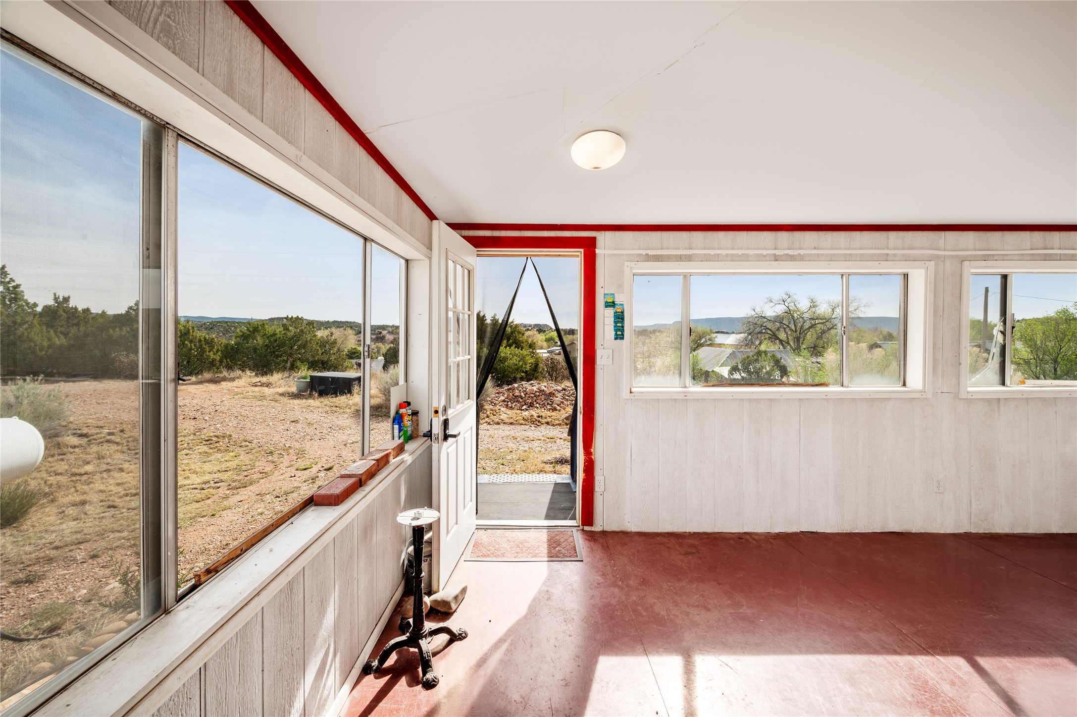 3-4 County Rd B41C San Jose, NM 87565 - Photo 28 of 41 Enclosed wrap around porch. Kit building.