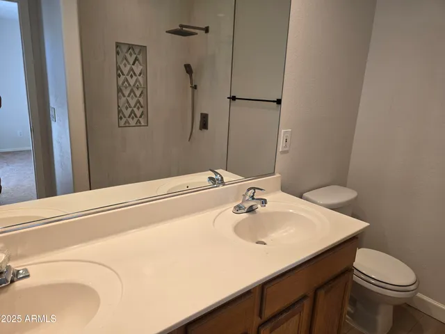 a bathroom with a sink toilet and vanity