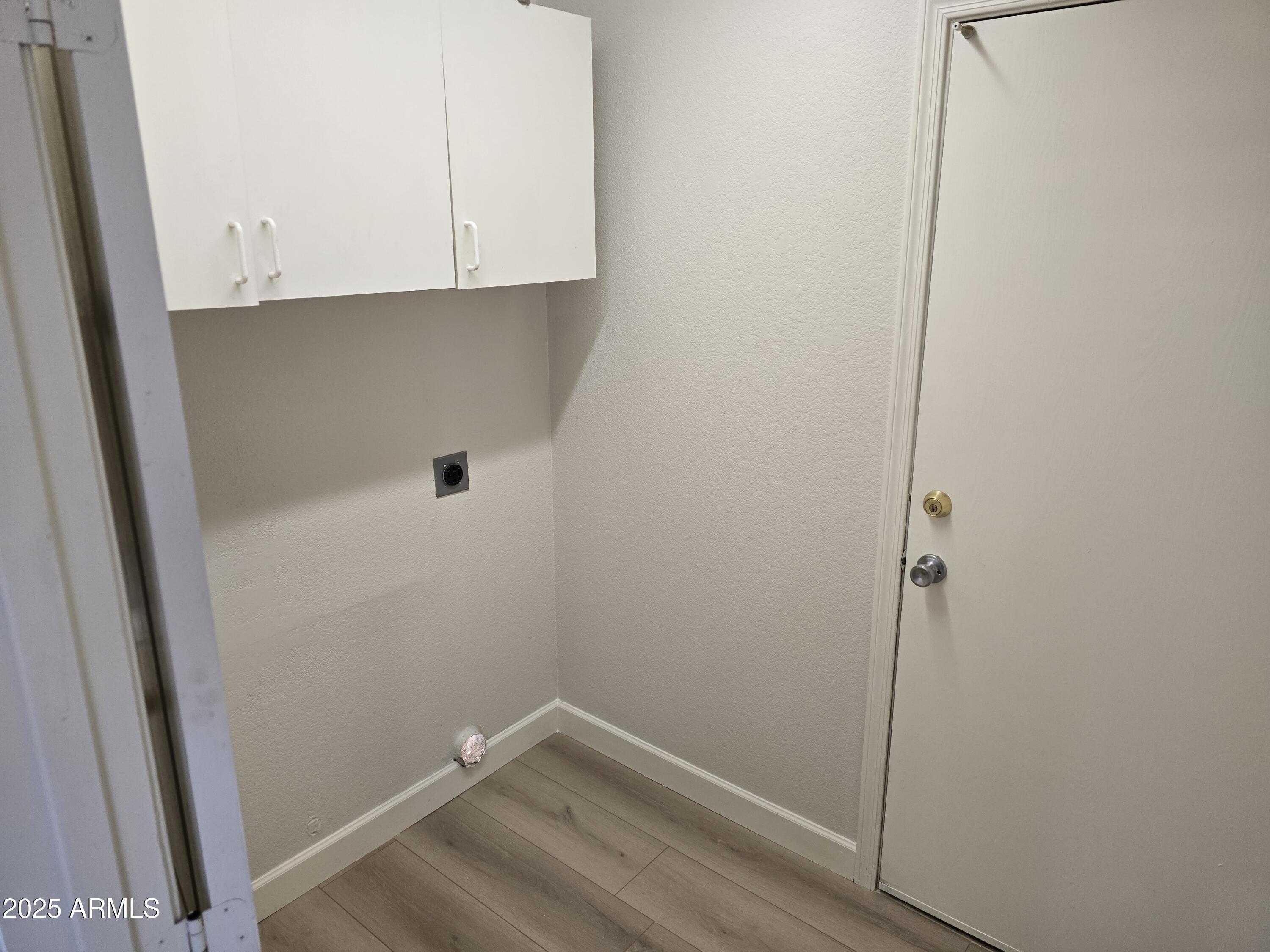 1443 West 14th Avenue Apache Junction, AZ 85120 - Photo 15 of 21 a view of small space with wooden floor