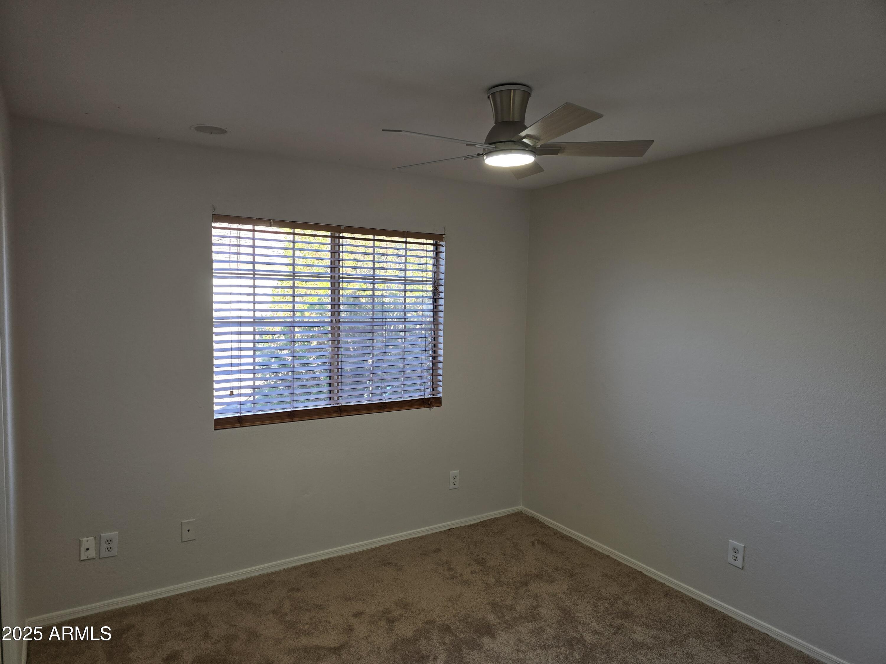 1443 West 14th Avenue Apache Junction, AZ 85120 - Photo 9 of 21 an empty room with a window