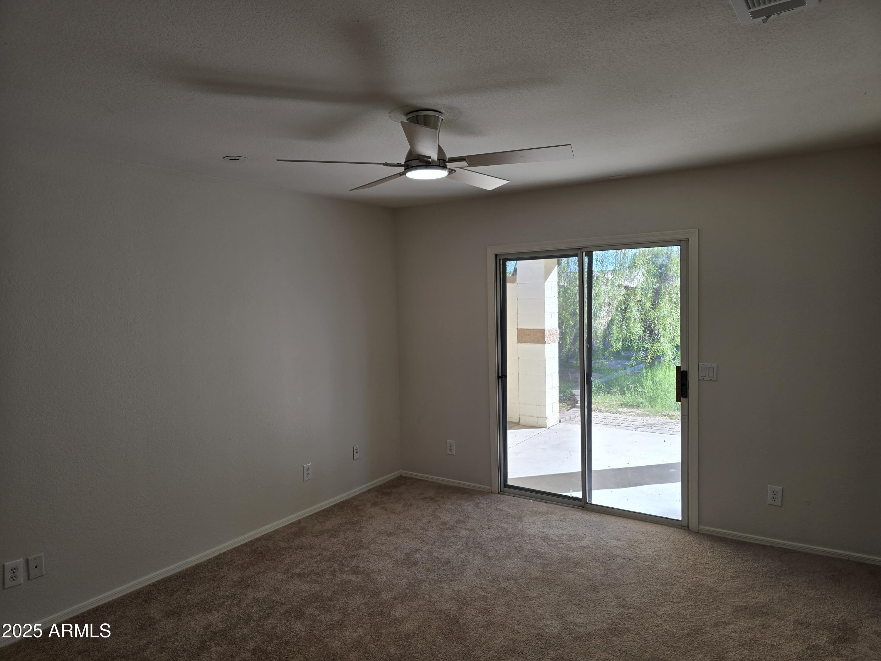 1443 West 14th Avenue Apache Junction, AZ 85120 - Photo 10 of 21 an empty room with windows