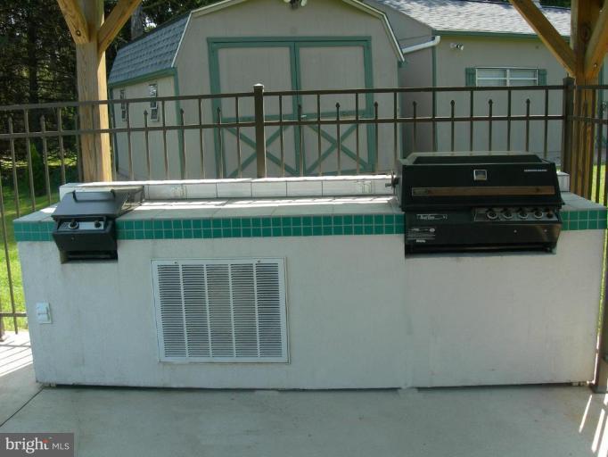 2910 Dublin Road Street, MD 21154 - Photo 16 of 30 Custom Made BBQ area at Poolside---under Cover