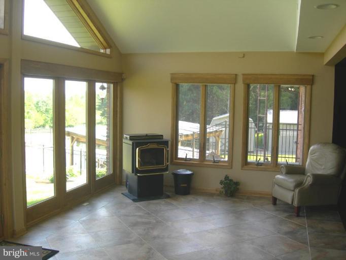 2910 Dublin Road Street, MD 21154 - Photo 6 of 30 Sunroom with Pellet and Coal Stove