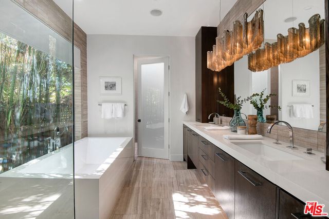 a bathroom with a bathtub and a sink