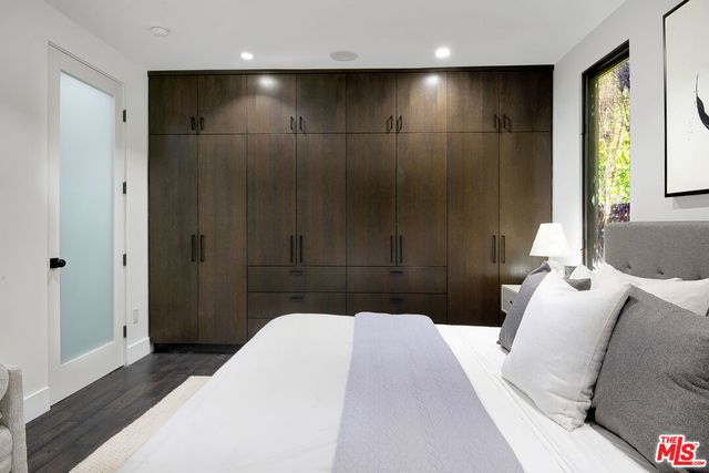 a bedroom with a bed and a bathroom