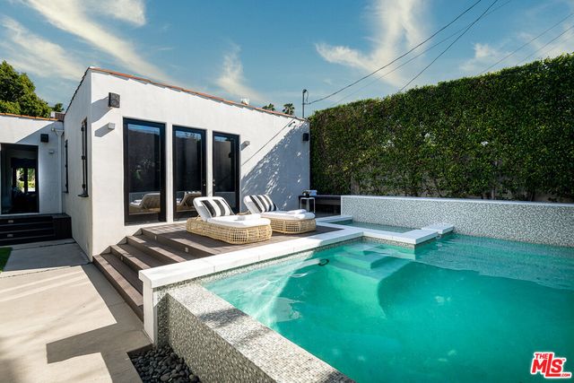 a view of an chairs and tables in the patio