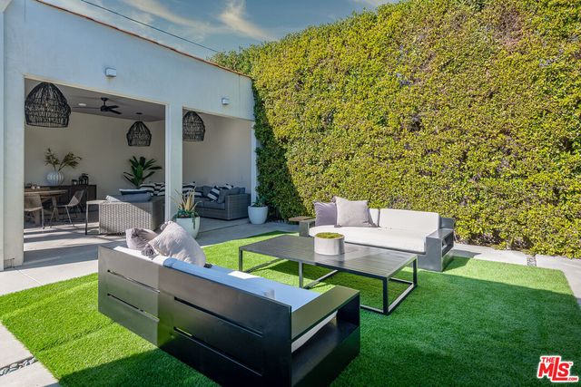 a backyard of a house with seating space