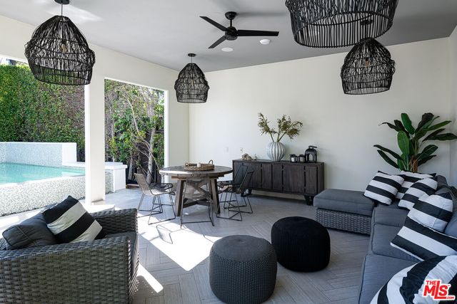 a view of a dining room with furniture window and outside view