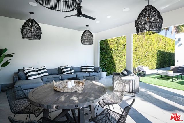 a view of an chairs and tables in the patio