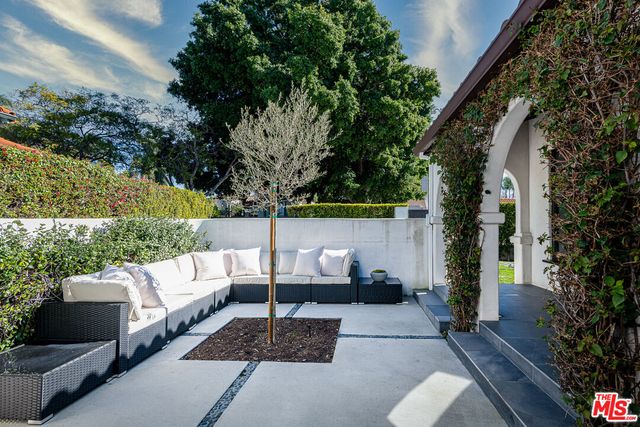a view of a couches in the back yard of the house