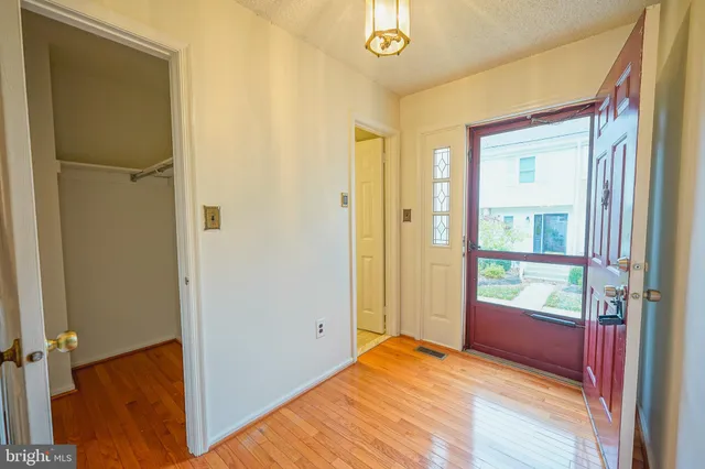 a very nice looking room with a dining table chairs and entryway