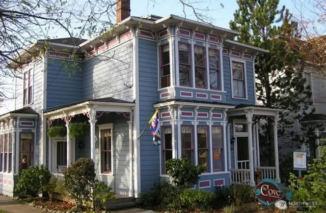front view of a building with potted plants