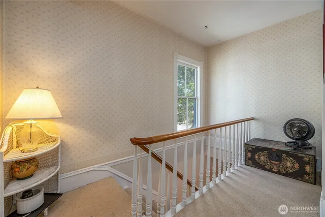 a hallway with a sink and cabinets