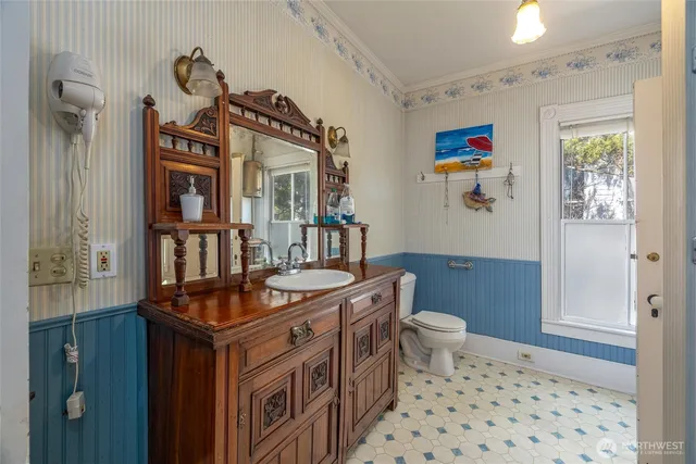 a bedroom with a bed furniture and a window