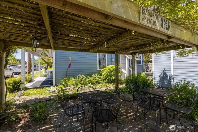 a view of a house with a yard and garden