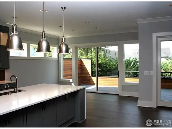 a kitchen with stainless steel appliances a sink a stove and a refrigerator