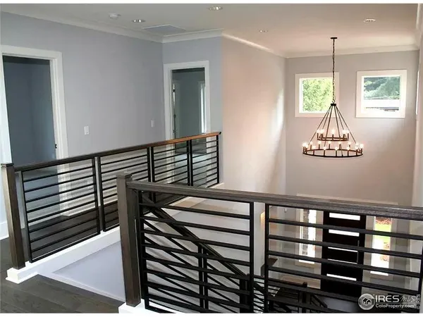 a kitchen with kitchen island a counter top space appliances and a ceiling fan