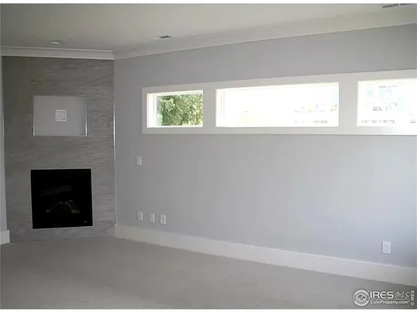 a kitchen with stainless steel appliances a large window
