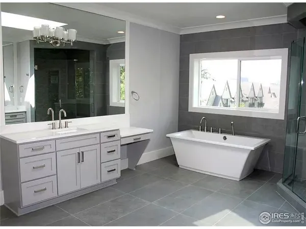 a bathroom with a bathtub and shower