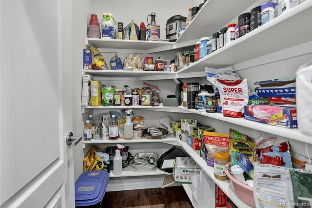 a room with lots of clutter and furniture