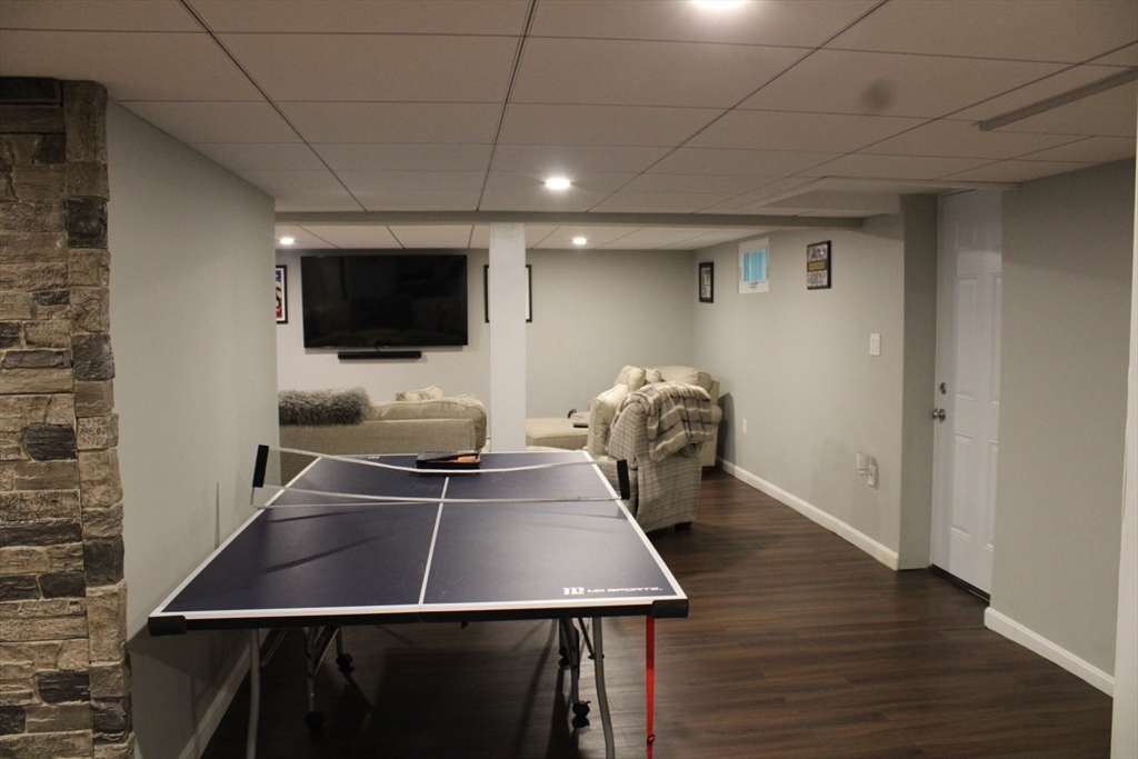 225 Braemoor Road Brockton, MA 02301 - Photo 24 of 29 a room with furniture and a flat screen tv