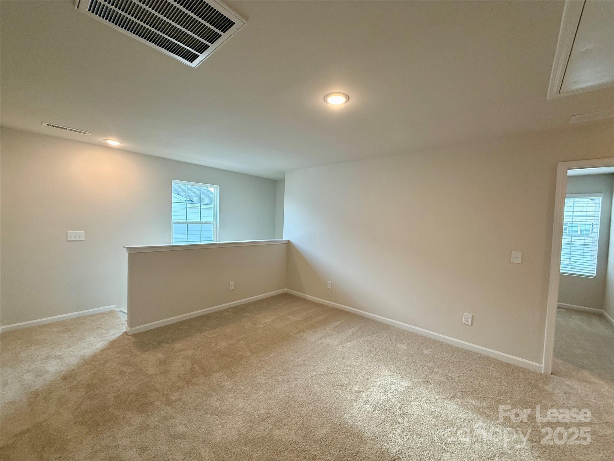 117 Dorian Place Troutman, NC 28166 - Photo 16 of 31 an empty room with windows