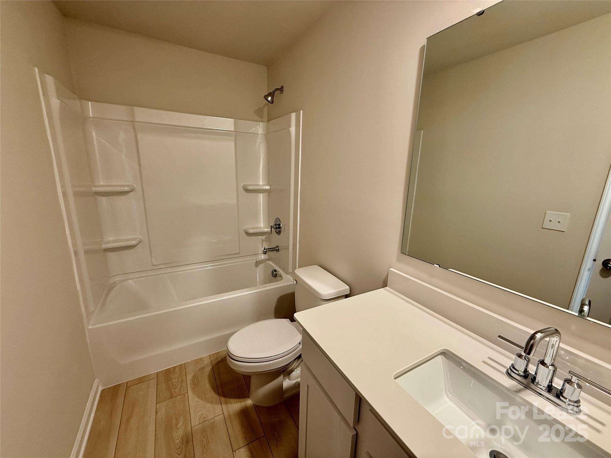 117 Dorian Place Troutman, NC 28166 - Photo 22 of 31 a bathroom with a sink a toilet and shower