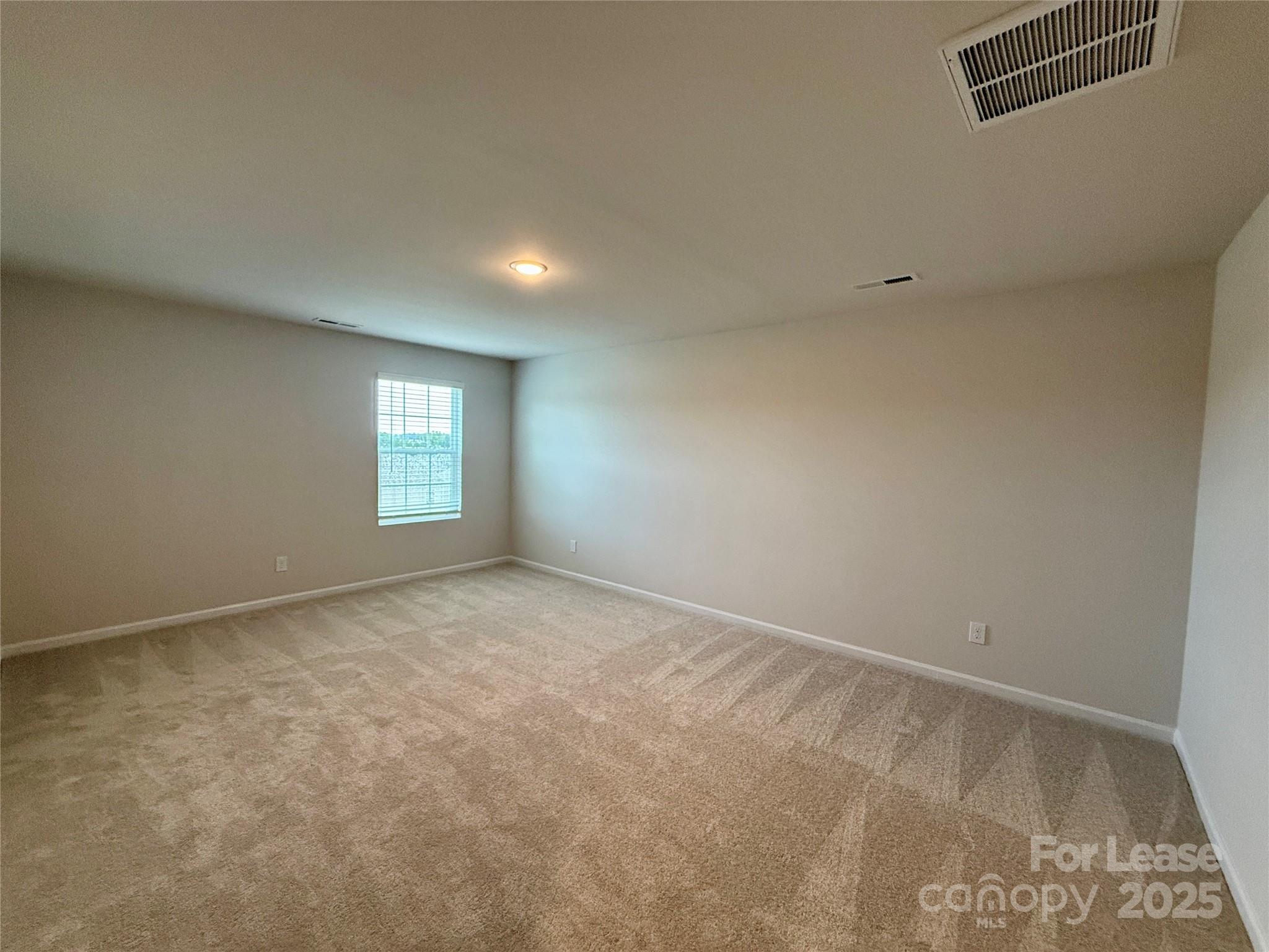 117 Dorian Place Troutman, NC 28166 - Photo 25 of 31 a view of an empty room and window