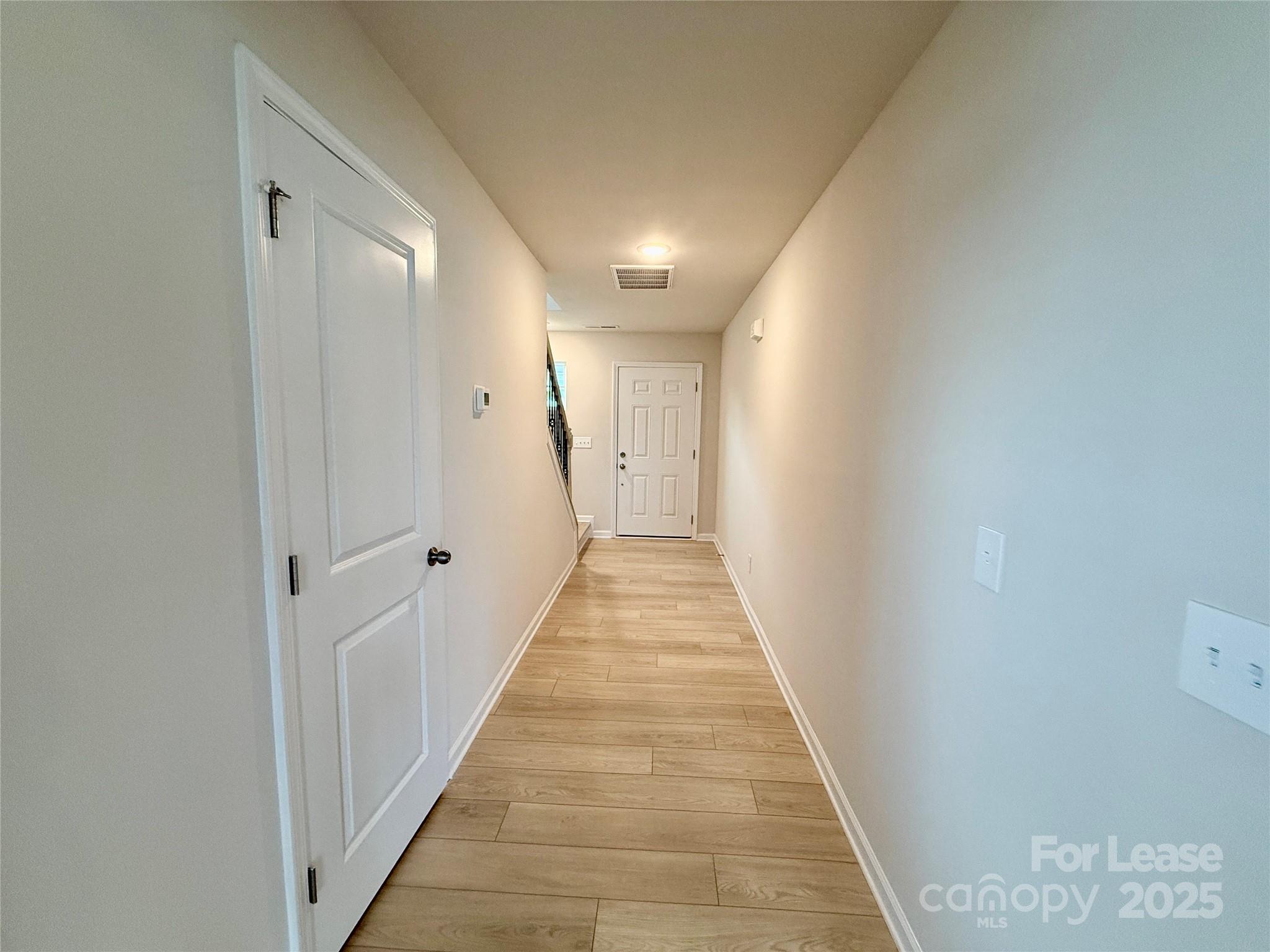 117 Dorian Place Troutman, NC 28166 - Photo 5 of 31 a view of a hallway with white walls