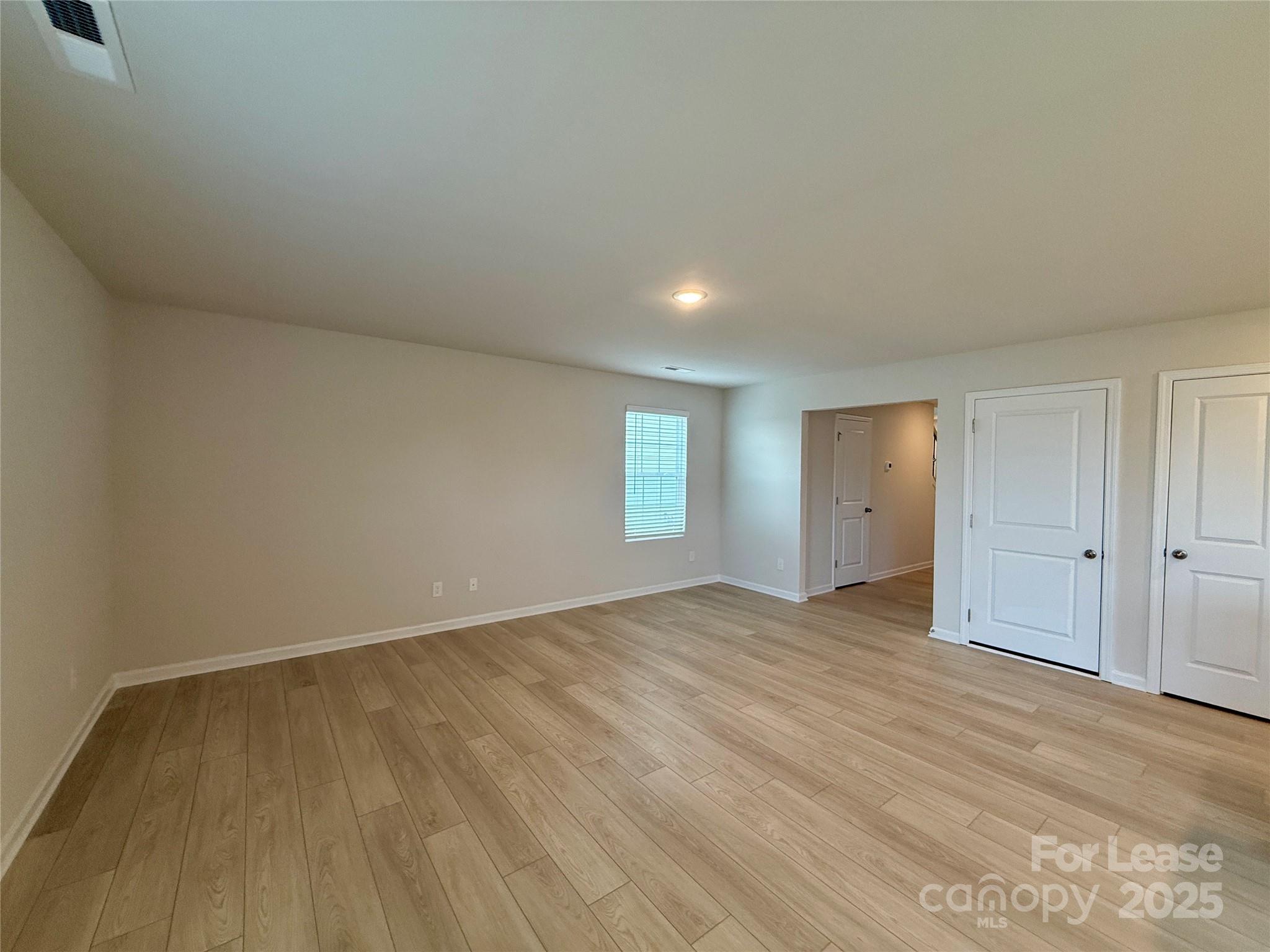 117 Dorian Place Troutman, NC 28166 - Photo 6 of 31 a view of an empty room and window