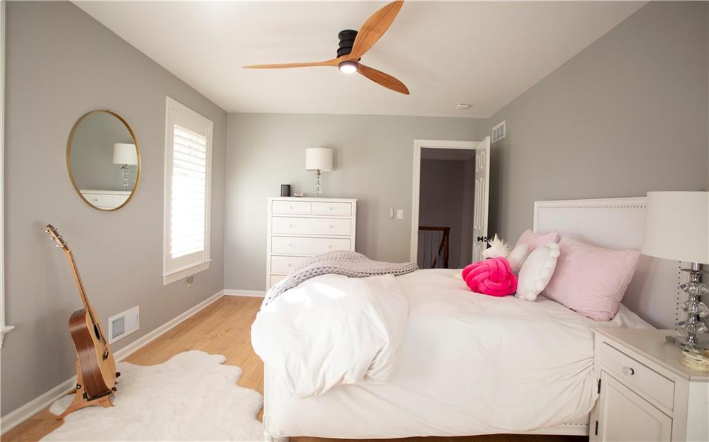 255 Camp Run Road Harmony, PA 16037 - Photo 26 of 49 a bedroom with a bed a chandelier and a dresser